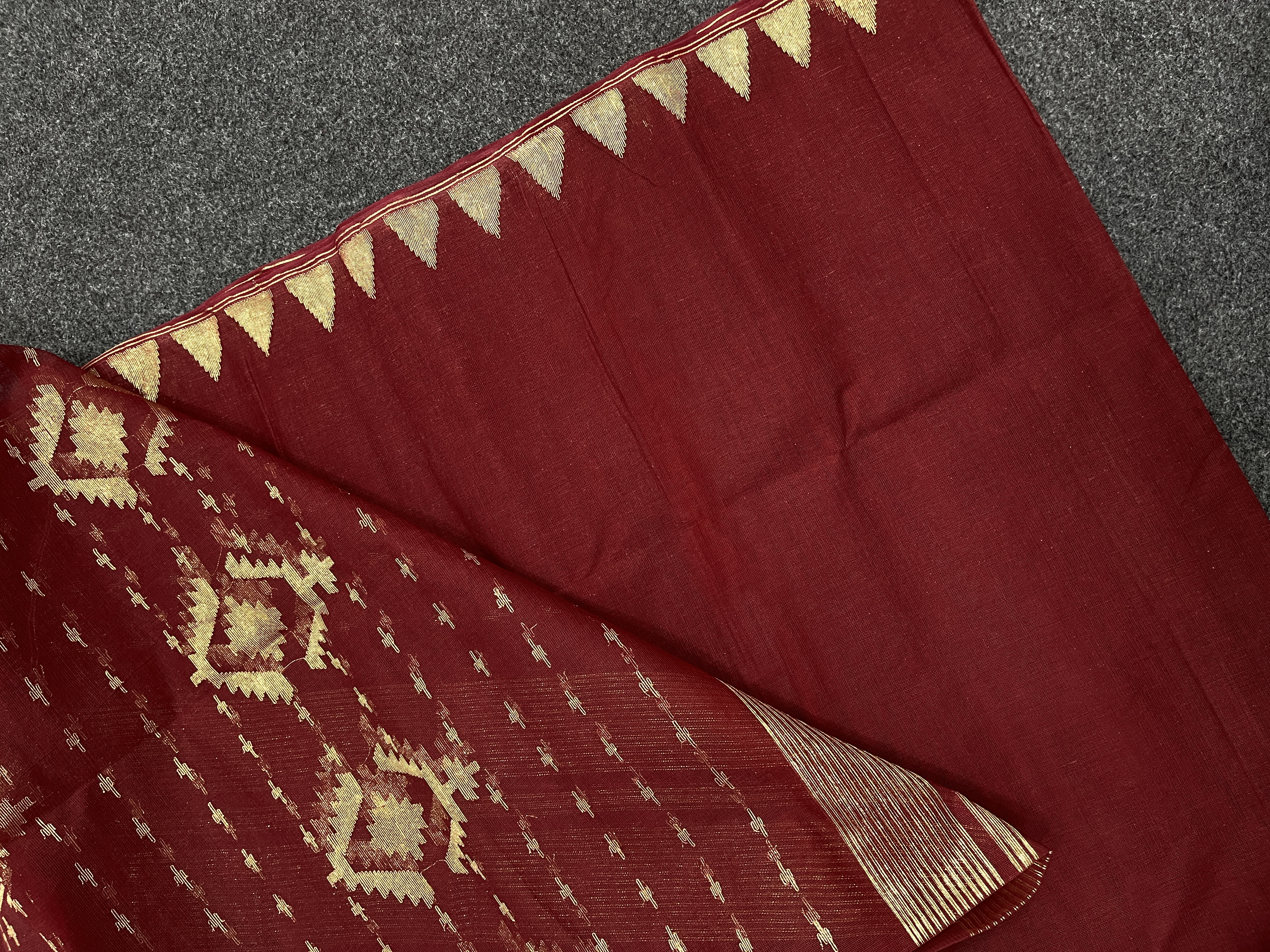 Maroon cotton jamdani saree.